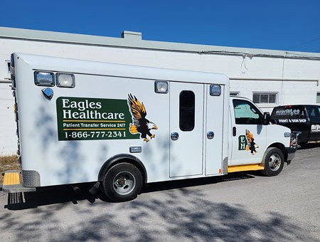 Commercial van with Eagle branding, partial wrap and vinyl lettering, Mr Print Canada